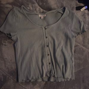 Green buttoned shirt.